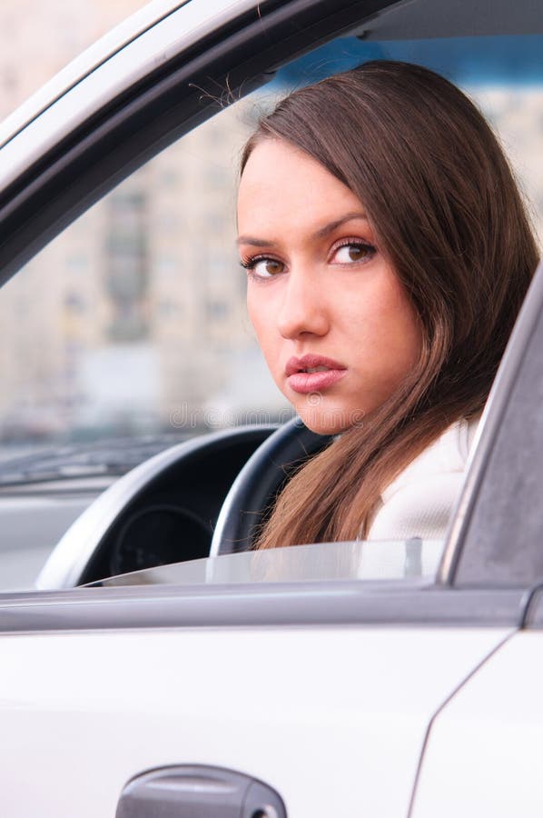 Young woman in a car stock image