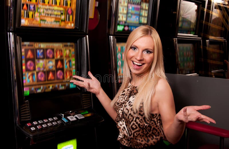 Lucky Woman Playing Slot Machines In Casino Editorial 