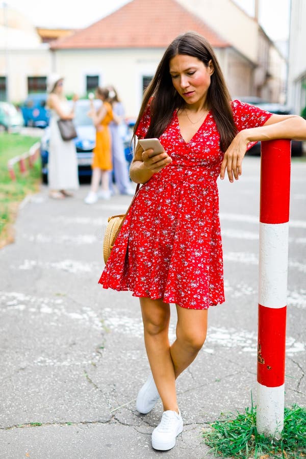 Young woman checking her smart phone stock image