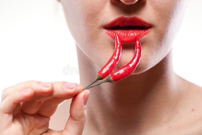 Woman with chili pepper isolated on white