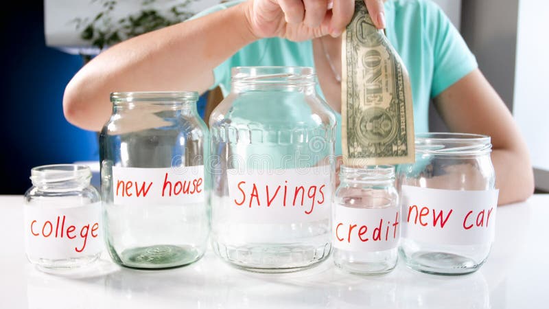 Young woman choosing where to invest money savings. Concept of financial investment, economy growth and bank savings stock photography