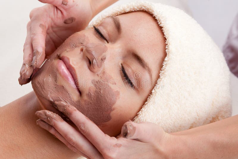 Young woman with clay facial mask. stock photo Young woman with clay facial mask. stock photo