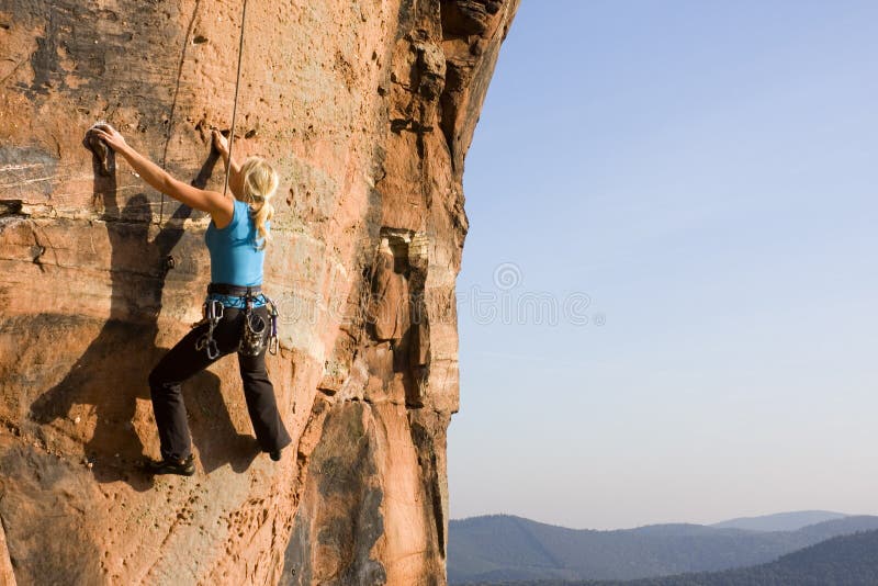 Young woman climbing royalty free stock image Young woman climbing royalty free stock image