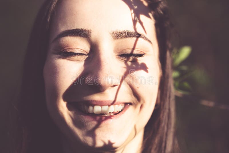 Young woman closeup face portrait in the woods royalty free stock image Young woman closeup face portrait in the woods royalty free stock image