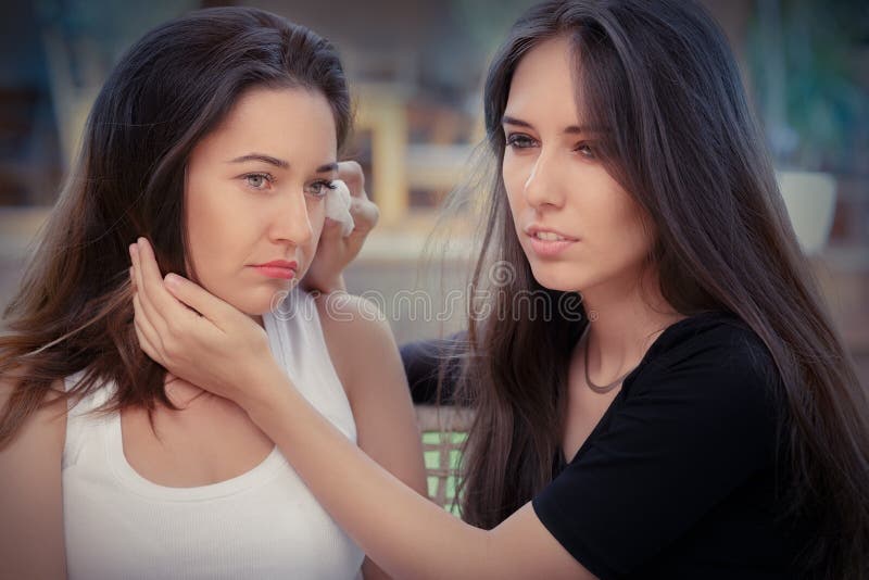 Portrait of Two women console each other in painful situation. Portrait of Two women console each other in painful situation