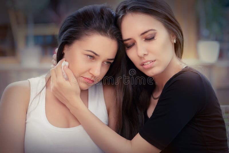 Portrait of Two women console each other in painful situation. Portrait of Two women console each other in painful situation