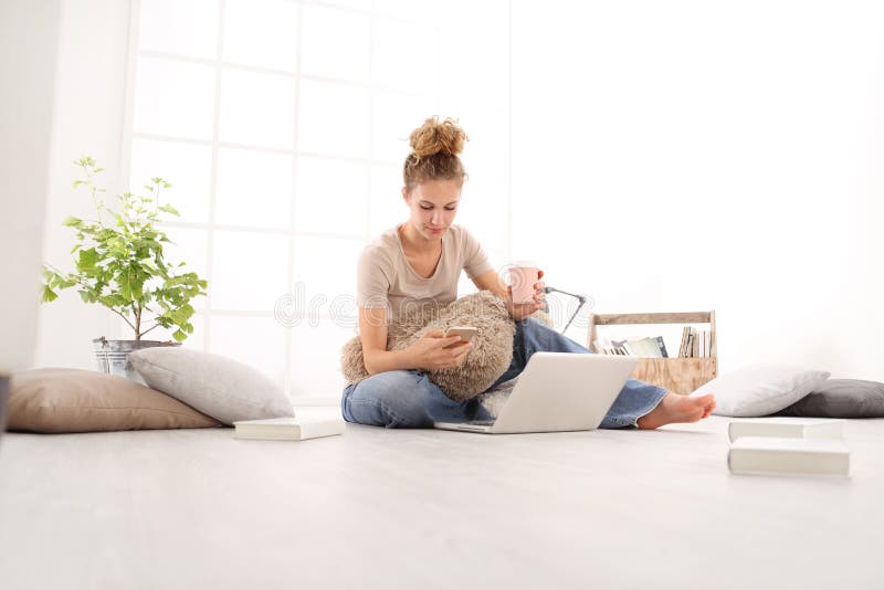 Young woman with computer use the smartphone and drink coffee, s