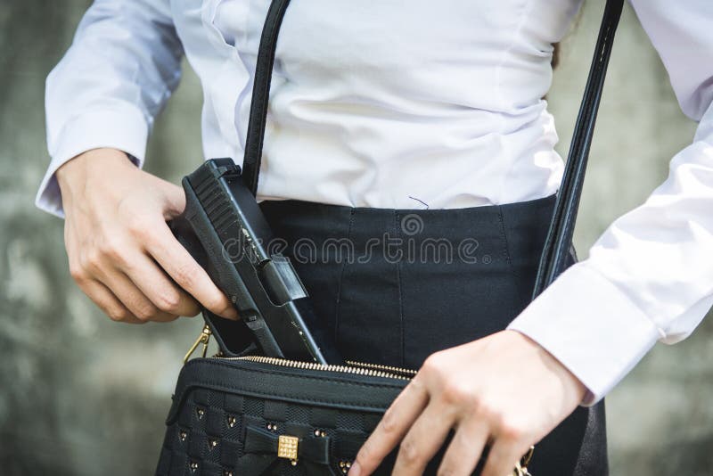 Young woman with concealed weapon