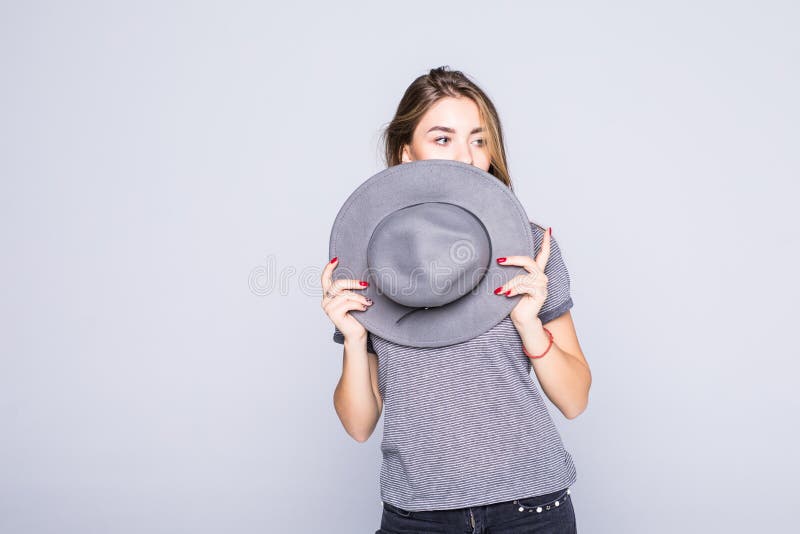 Young woman cover face with summer hat isolated on white background royalty free stock photos Young woman cover face with summer hat isolated on white background royalty free stock photos