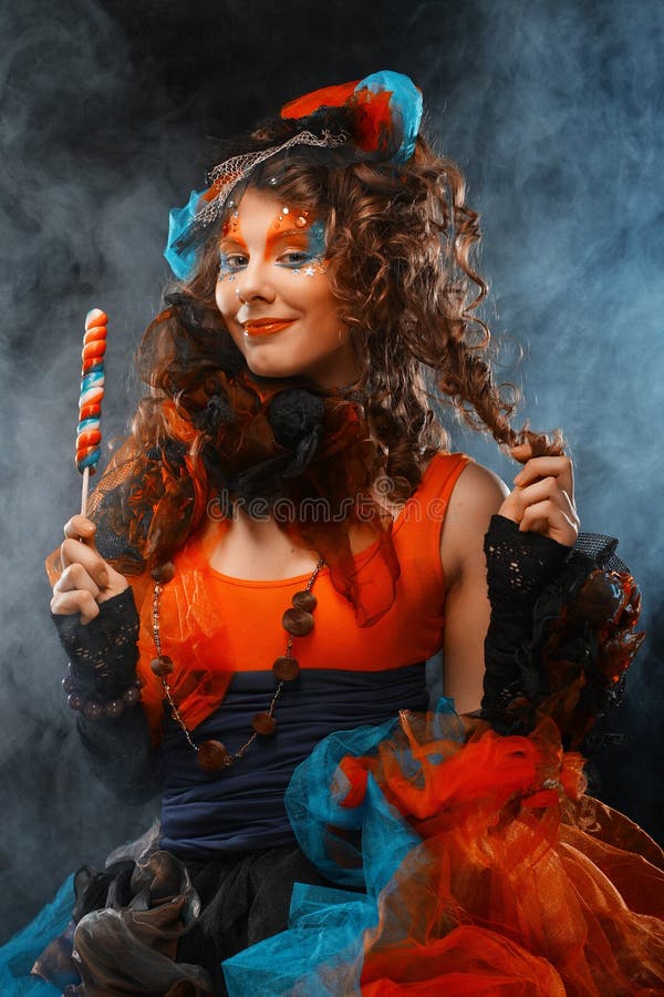 Woman with creative make-up in doll style with candy. stock photos Woman with creative make-up in doll style with candy. stock photos