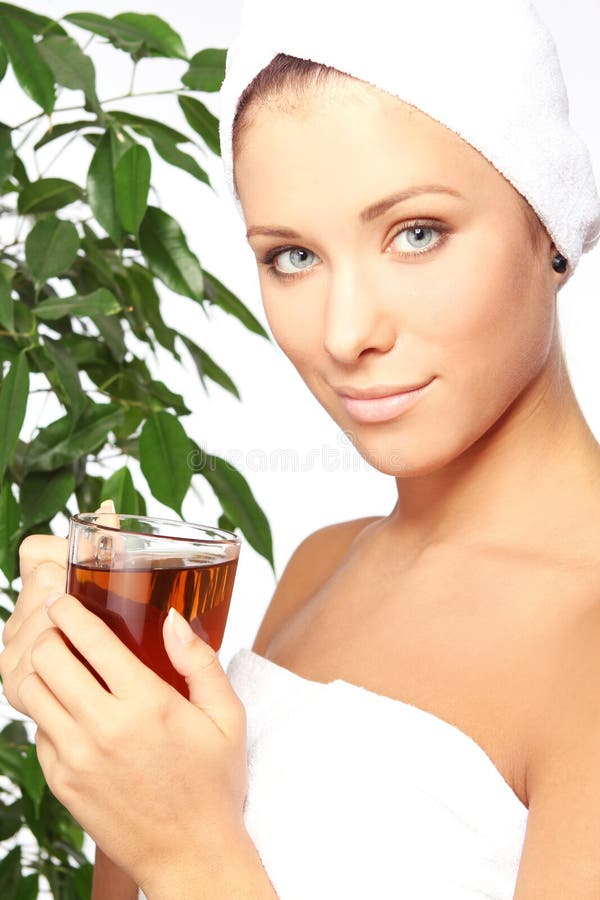 Young woman with cup of hot tea