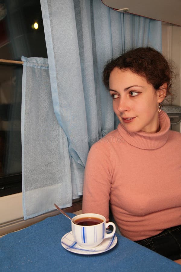 Young woman with cup of tea