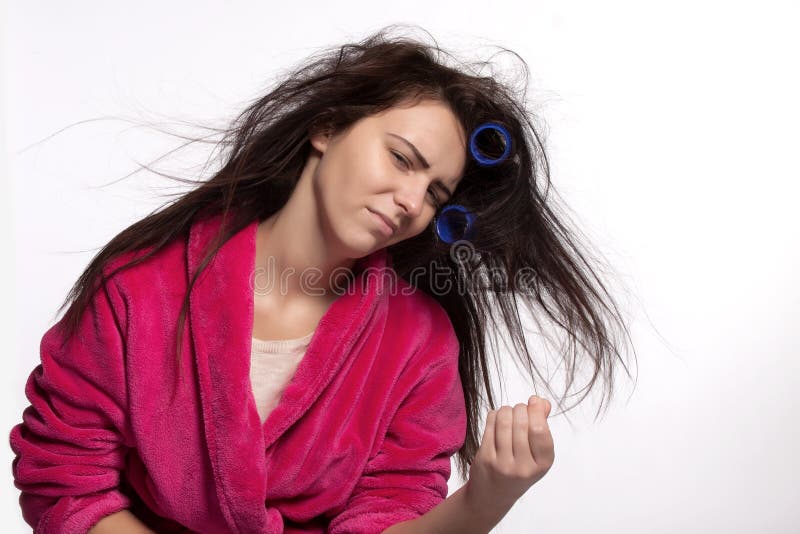 Young woman with curlers