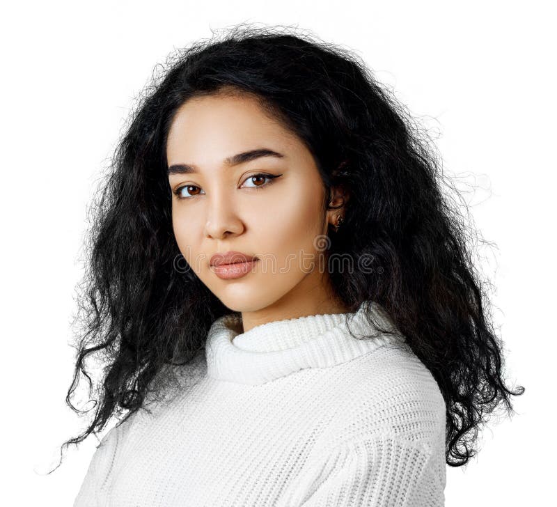 Young woman with curly black hair.