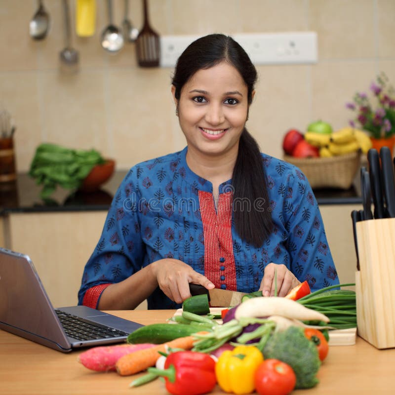 Young Indian Woman Cutting Vegetables Stock Photos Free & Royalty