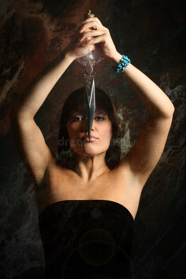 The young woman with a dagger royalty free stock photos The young woman with a dagger royalty free stock photos