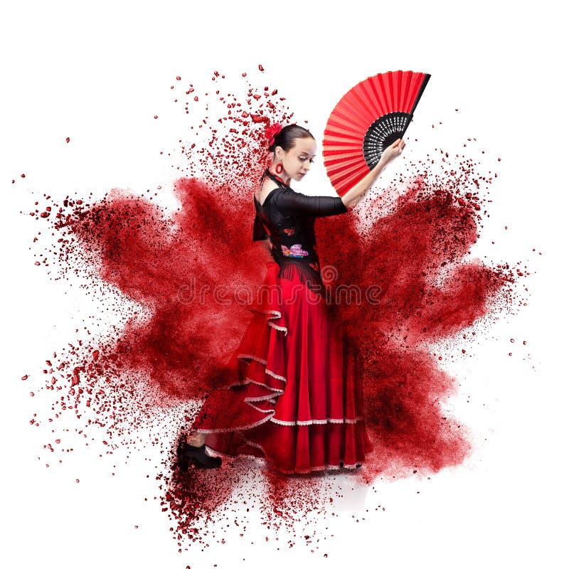 Young woman dancing flamenco against explosion