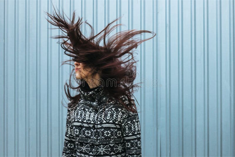 Young woman with dark straight long hairs in motion stock image Young woman with dark straight long hairs in motion stock image