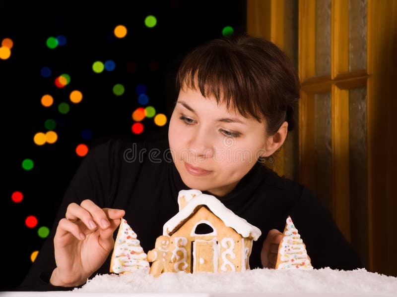 Gingerbread House with Gingerbread Man and Christmas Trees Stoc