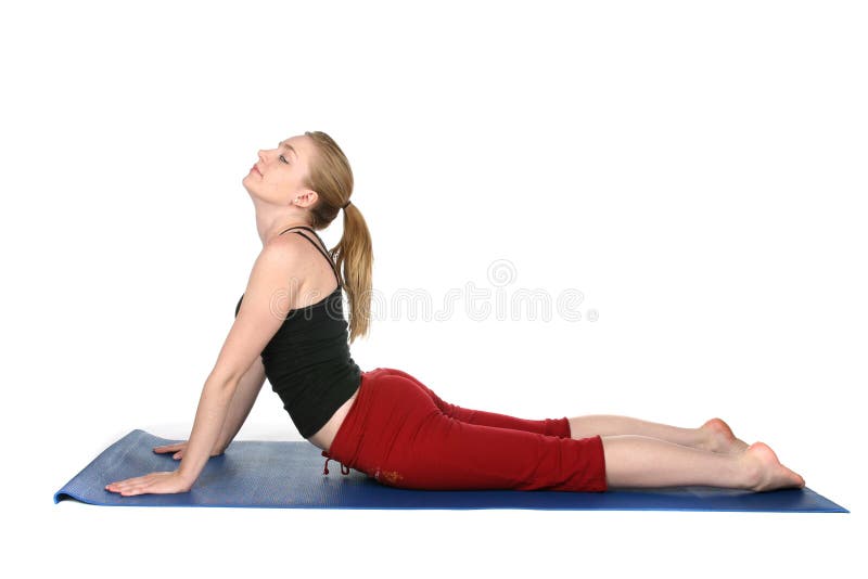 Young woman demonstrating cobra pose in yoga