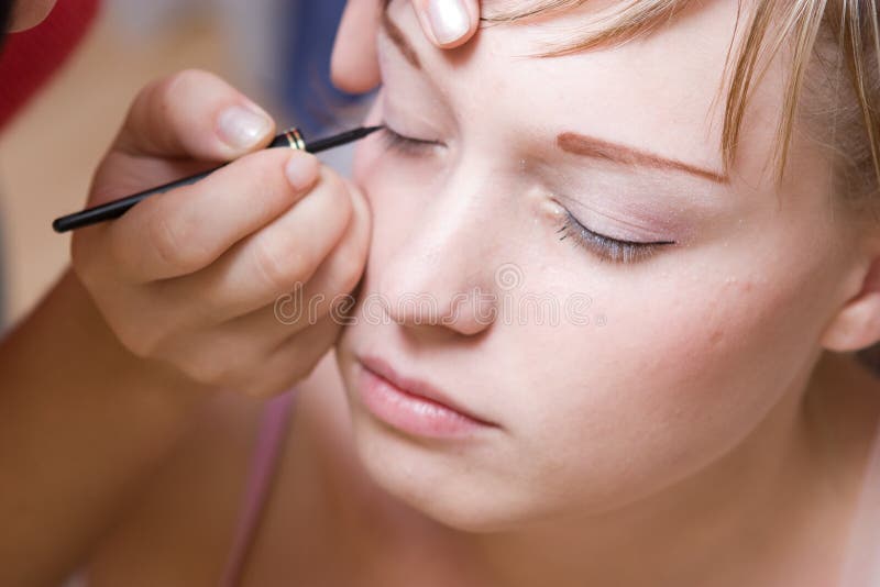 Young woman directs a make-up in the morning