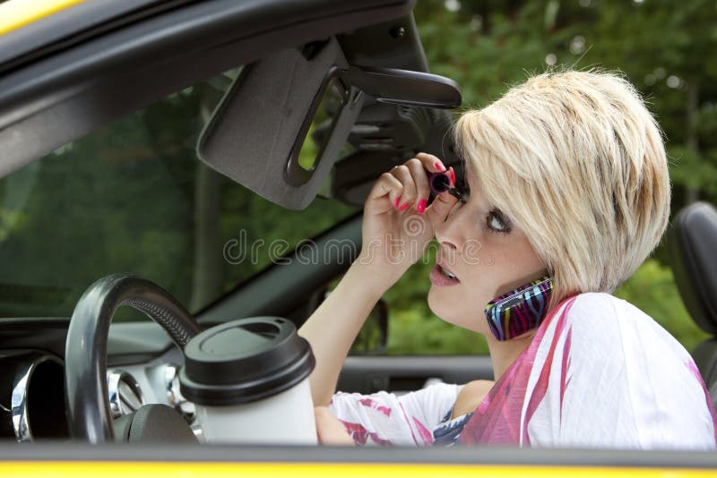 Young woman distracted while driving