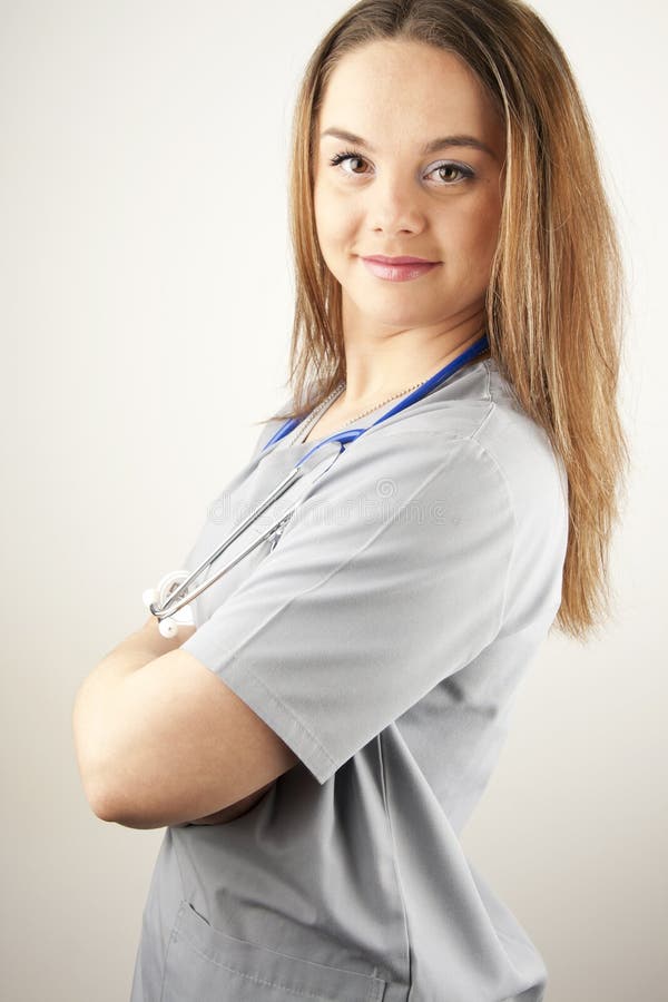 Young woman doctor or nurse wearing scrubs