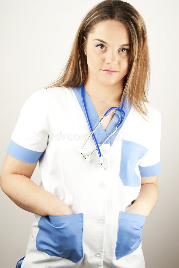 Young woman doctor or nurse wearing scrubs