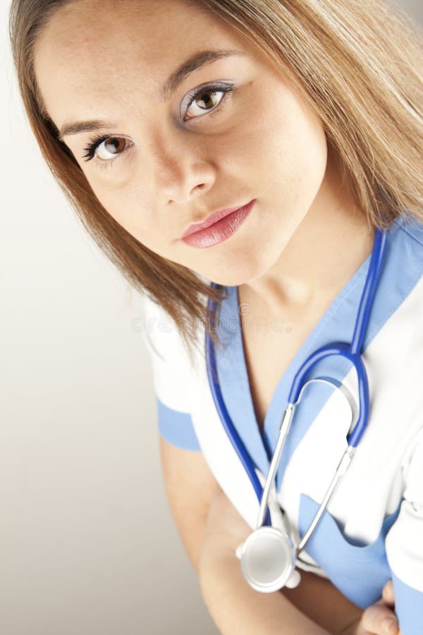 Young woman doctor or nurse wearing scrubs