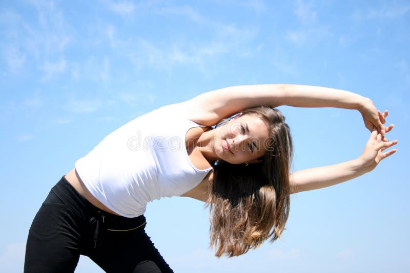 Young woman doing fitness exercises