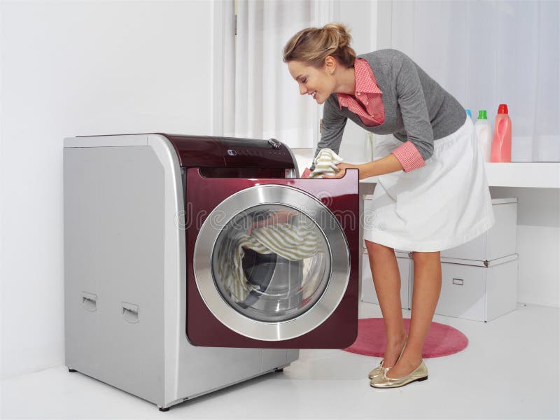 Young woman doing laundry stock images Young woman doing laundry stock images