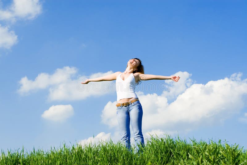 Young woman dreams to fly on winds