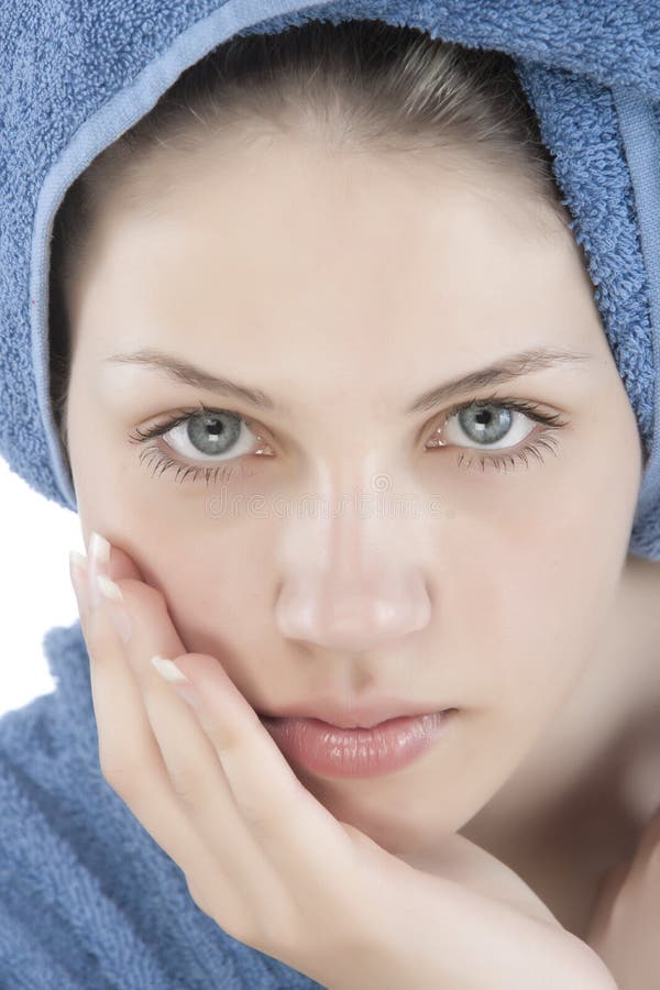 Young woman dressed blue bathrobe