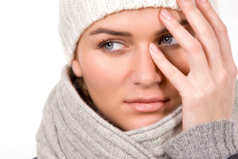 Young woman dressed winter style clothes on white