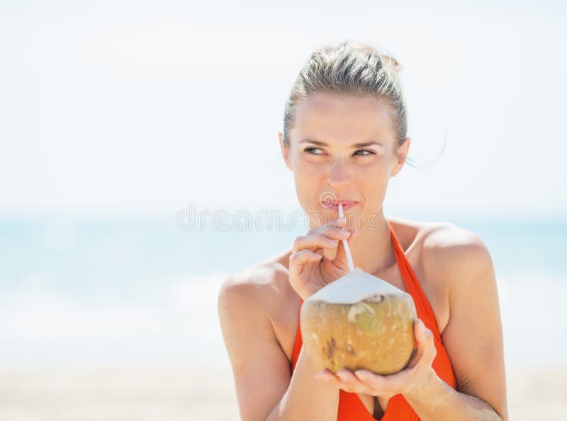 Young Woman Drinking Coconut Milk on Beach Stock Image Image of juicy, outside 39331609