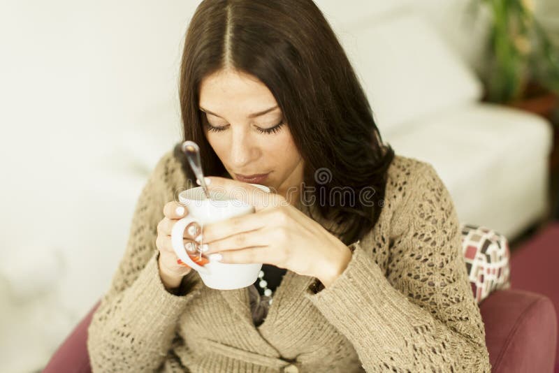 Young woman drinking tea stock image. Image of hand, calm - 36074627