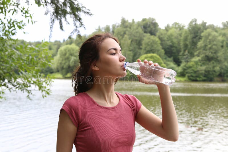 Young woman drinking water. royalty free stock images Young woman drinking water. royalty free stock images