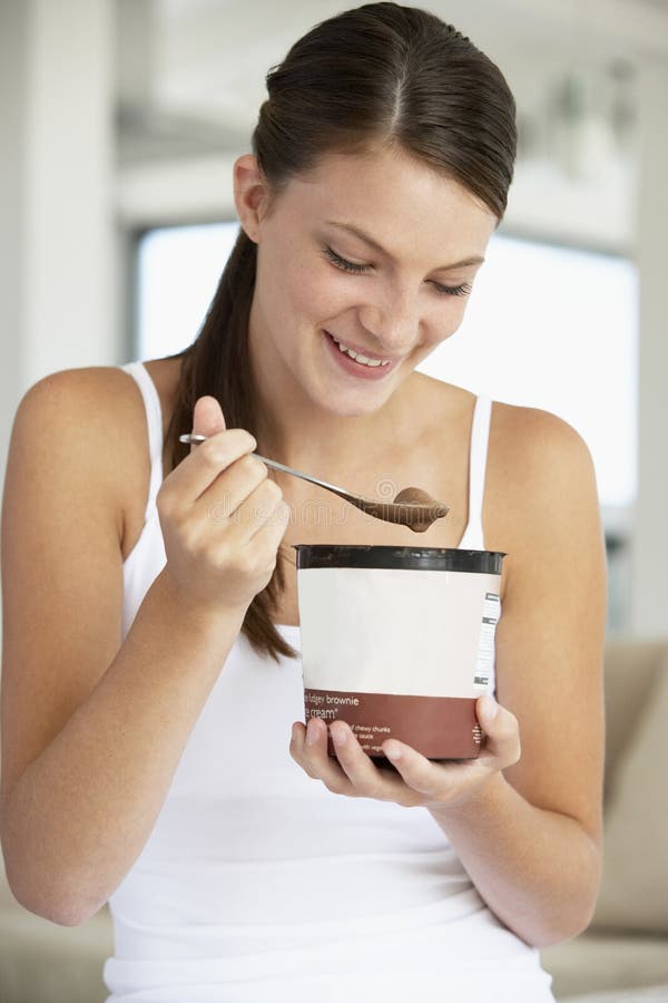 Young Woman Eating Chocolate Ice-Cream