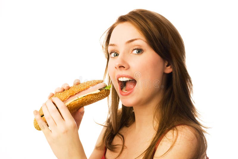 Young woman eating a hot dog