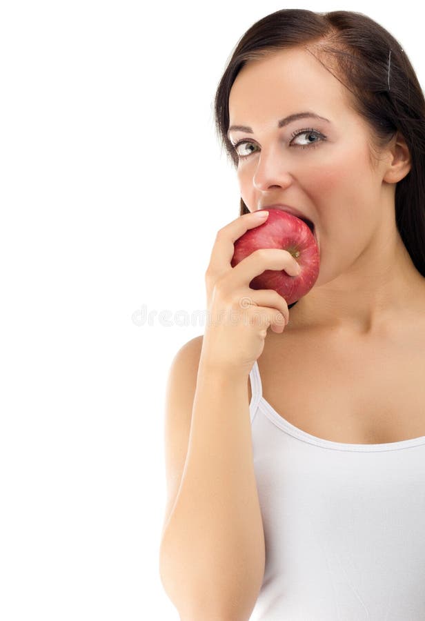 Young woman eating red apple diet time