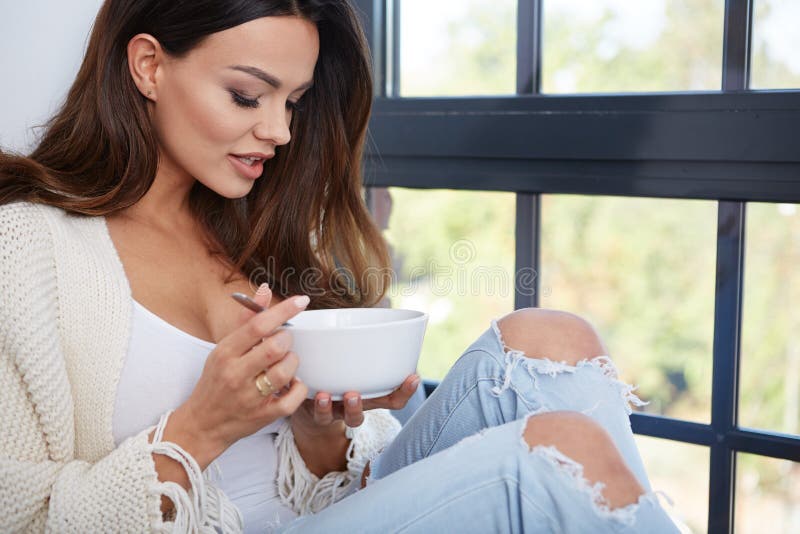 Young woman eating soup. stock image. Image of lunch 61397639