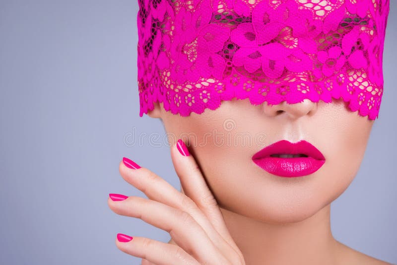 Elegant lace blindfold covering a woman's eyes, her lips parted in sensual anticipation, soft intimate close-up