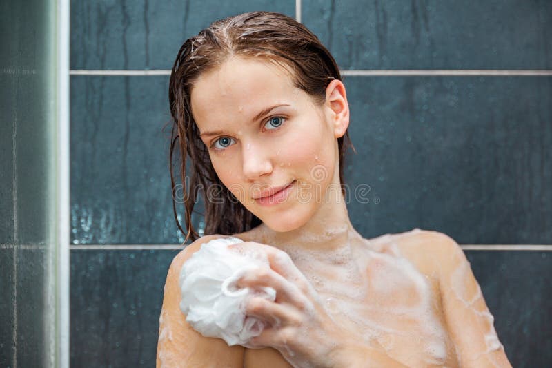 Young beauty under shower. 