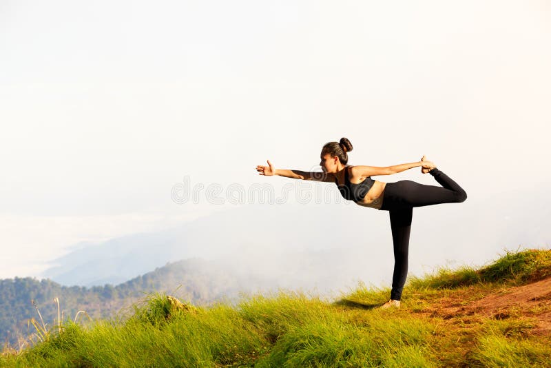 Young woman exercises yoga