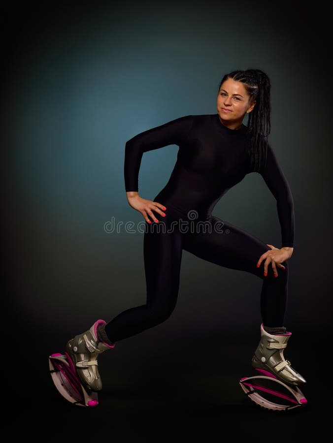 Female Trainer Doing Exercises Jumping In The Kangoo Jumps Boots Stock  Photo - Download Image Now - iStock