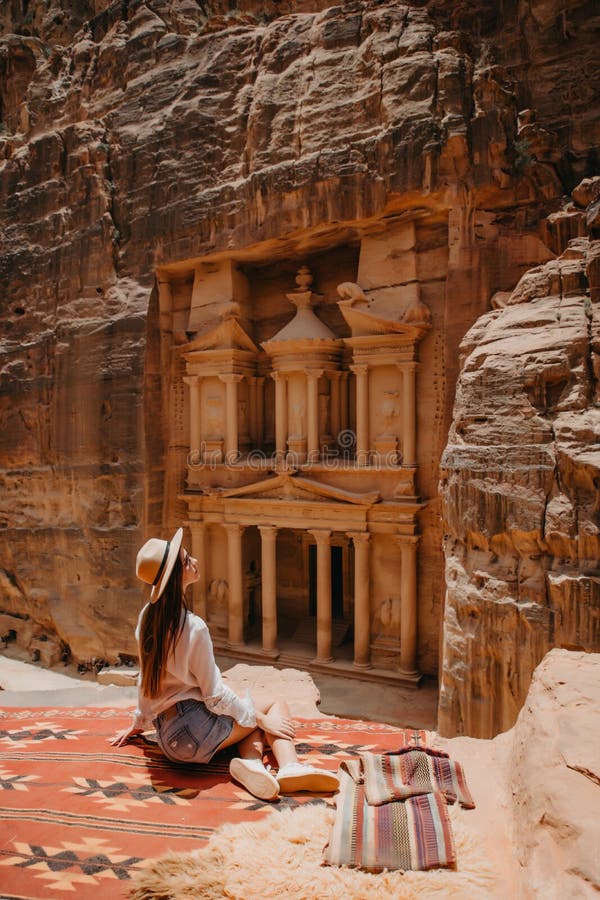 Young woman, exploring the sights of the ancient city of Petra in Jordan