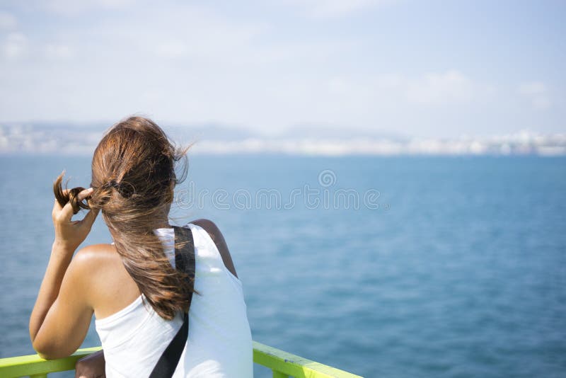 Young woman on ferry looking toward her destination royalty free stock image Young woman on ferry looking toward her destination royalty free stock image