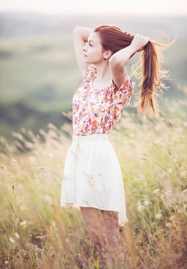 Young woman in a field stock image