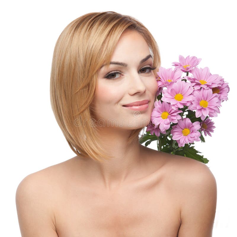 Young woman with flowers next to her face