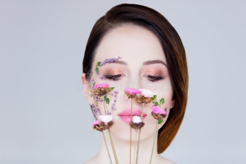 Young woman with flowers royalty free stock photo